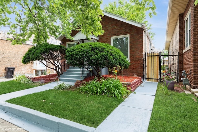 7915 S Justine St, Chicago, IL 60620 - view of front of property with a gate and brick siding