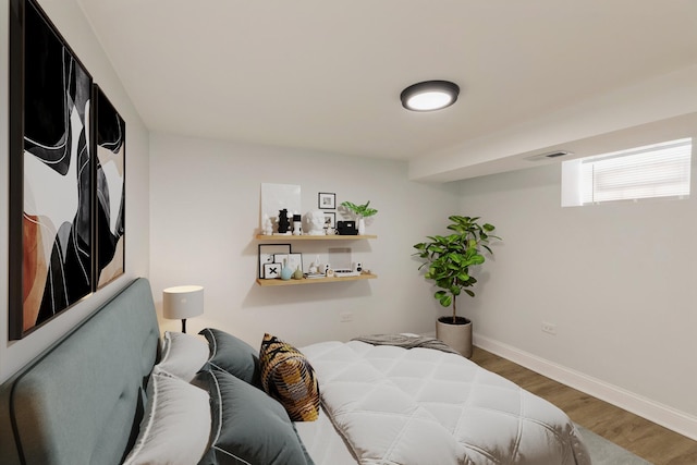 7915 S Justine St, Chicago, IL 60620 - bedroom featuring wood finished floors and baseboards