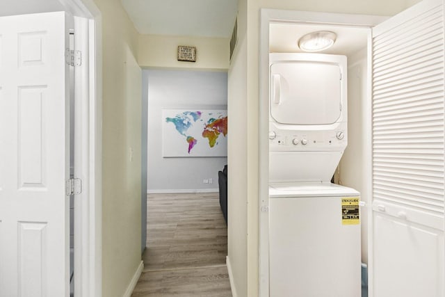 1521 S County Farm Rd Unit 2-2, Wheaton, IL 60189 - laundry area featuring stacked washer / drying machine and light wood finished floors
