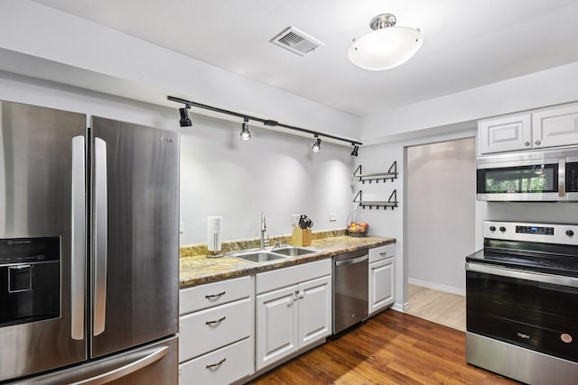 1521 S County Farm Rd Unit 2-2, Wheaton, IL 60189 - kitchen with stainless steel appliances, dark wood-style floors, white cabinetry, and track lighting
