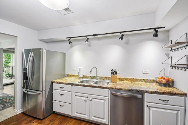 1521 S County Farm Rd Unit 2-2, Wheaton, IL 60189 - kitchen featuring stainless steel appliances, track lighting, dark wood finished floors, light stone countertops, and white cabinetry