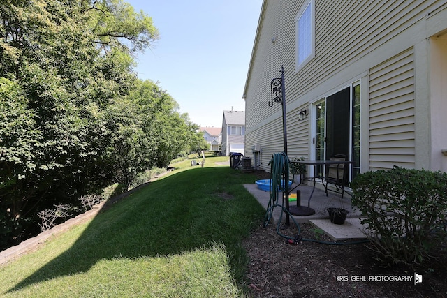 39092 Welsh Ln, Beach Park, IL 60083 - view of grassy yard featuring a patio