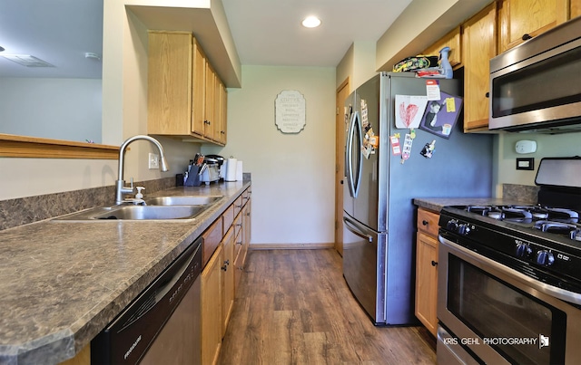 39092 Welsh Ln, Beach Park, IL 60083 - kitchen featuring appliances with stainless steel finishes, dark countertops, dark wood-style flooring, and recessed lighting