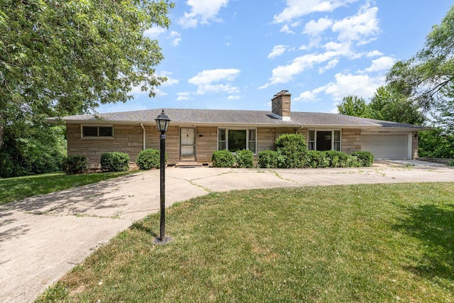 9225 S 84th Ave, Hickory Hills, IL 60457 - ranch-style house with a front yard, a garage, a chimney, and concrete driveway