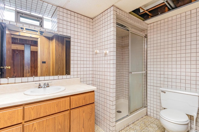 9225 S 84th Ave, Hickory Hills, IL 60457 - full bathroom with tile walls, a stall shower, vanity, and tile patterned flooring