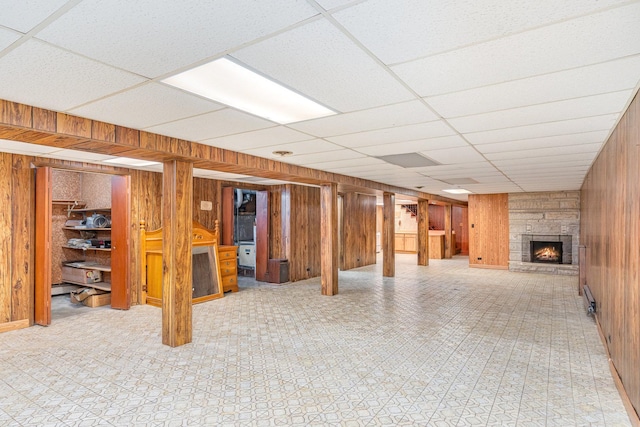 9225 S 84th Ave, Hickory Hills, IL 60457 - finished basement with wood walls, a drop ceiling, and a stone fireplace