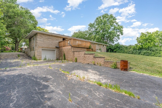9225 S 84th Ave, Hickory Hills, IL 60457 - mid-century home with stone siding, a front yard, asphalt driveway, and a garage