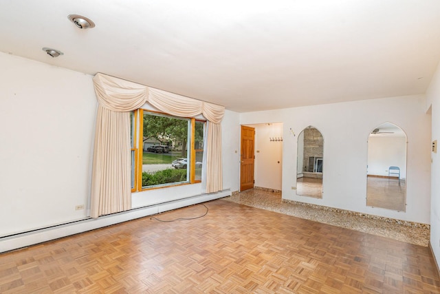 9225 S 84th Ave, Hickory Hills, IL 60457 - empty room with a baseboard heating unit and arched walkways