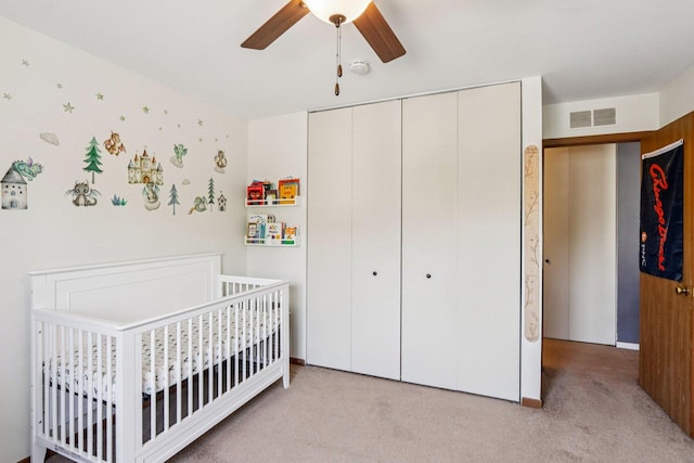 45 Orchard Ter Unit 7, Lombard, IL 60148 - bedroom featuring a closet, light carpet, a crib, and ceiling fan