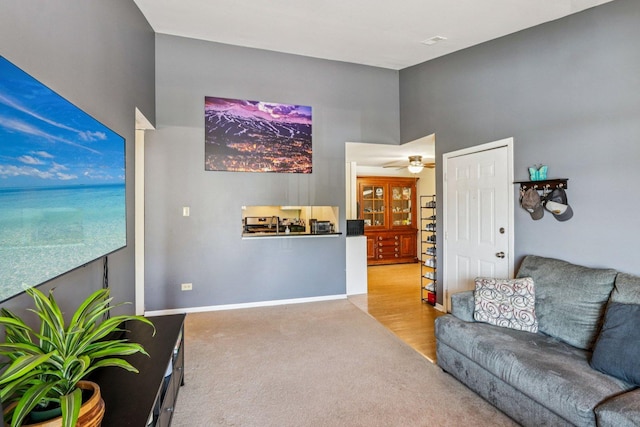 45 Orchard Ter Unit 7, Lombard, IL 60148 - living area featuring carpet floors, a towering ceiling, and ceiling fan