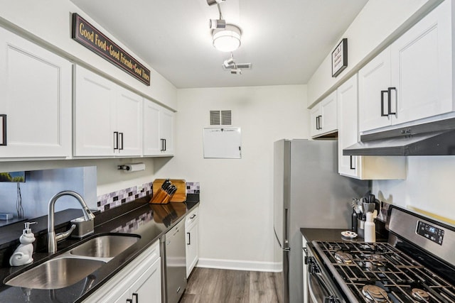 45 Orchard Ter Unit 7, Lombard, IL 60148 - kitchen featuring appliances with stainless steel finishes, under cabinet range hood, dark wood-type flooring, and white cabinets