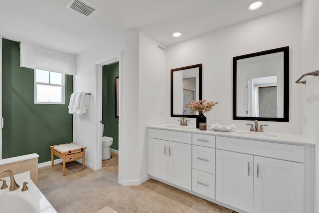 1063 Houston St Unit 89005, Batavia, IL 60510 - bathroom with double vanity, a tub to relax in, and recessed lighting