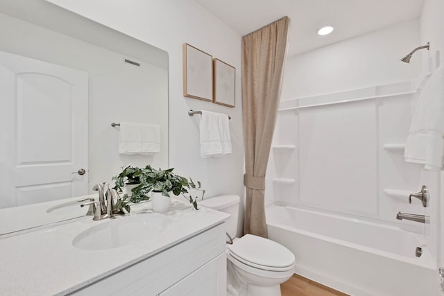 1063 Houston St Unit 89005, Batavia, IL 60510 - bathroom featuring shower / bath combo with shower curtain, vanity, wood finished floors, and recessed lighting