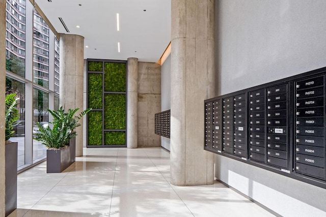600 N Fairbanks Ct Unit 3304, Chicago, IL 60611 - building lobby featuring a wall of windows and a high ceiling