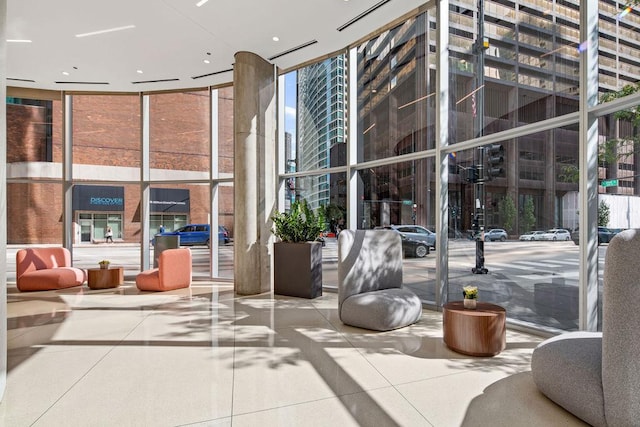 600 N Fairbanks Ct Unit 3304, Chicago, IL 60611 - building lobby featuring expansive windows and a high ceiling