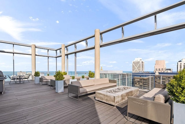 600 N Fairbanks Ct Unit 3304, Chicago, IL 60611 - deck with an outdoor living space with a fire pit, a water view, and a view of city