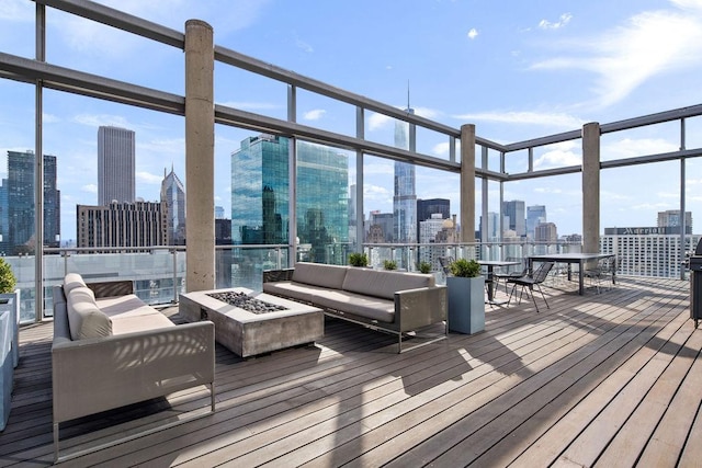 600 N Fairbanks Ct Unit 3304, Chicago, IL 60611 - wooden terrace with a view of skyline and an outdoor living space with a fire pit