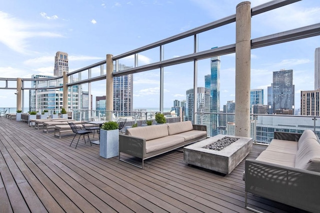 600 N Fairbanks Ct Unit 3304, Chicago, IL 60611 - wooden deck featuring a skyline view and an outdoor living space with a fire pit
