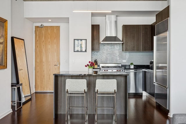 600 N Fairbanks Ct Unit 3304, Chicago, IL 60611 - kitchen featuring wall chimney range hood, modern cabinets, stainless steel appliances, dark countertops, and dark wood-type flooring