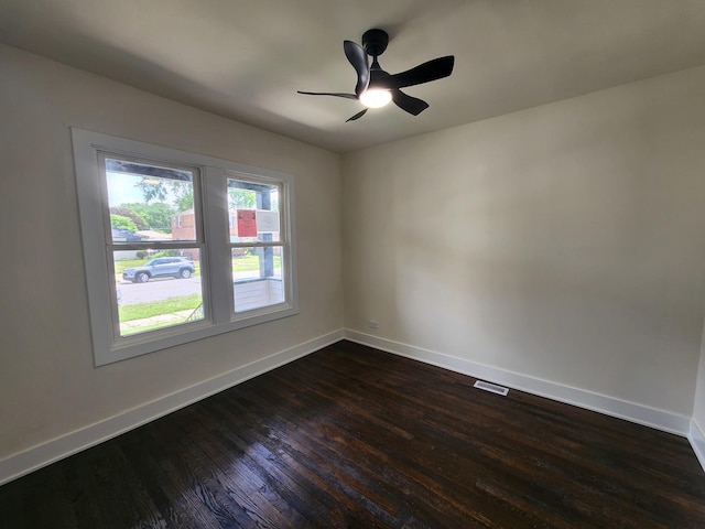 12416 S Carpenter St, Calumet Park, IL 60827 - empty room featuring dark wood-type flooring and a ceiling fan