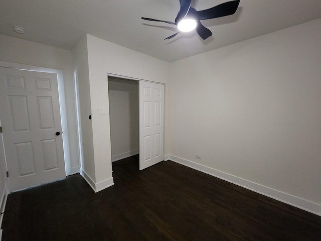 12416 S Carpenter St, Calumet Park, IL 60827 - unfurnished bedroom with dark wood-type flooring, a closet, and a ceiling fan