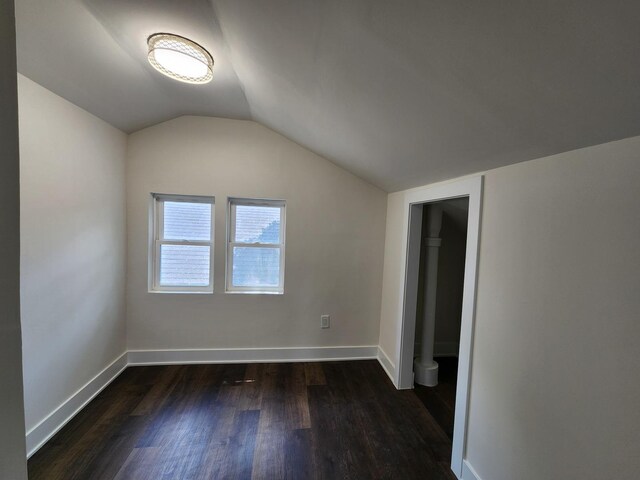 12416 S Carpenter St, Calumet Park, IL 60827 - unfurnished bedroom featuring dark wood-type flooring and lofted ceiling