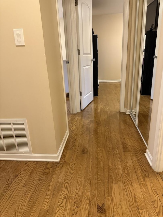 835 Williams Ct, Schaumburg, IL 60193 - hallway featuring dark wood finished floors and baseboards