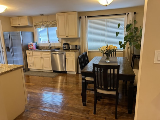 835 Williams Ct, Schaumburg, IL 60193 - kitchen featuring stainless steel appliances, dark wood-style floors, stone counters, and hanging light fixtures