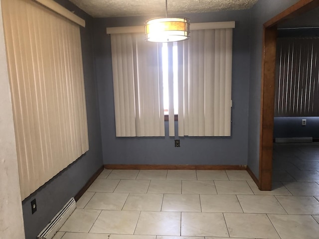 7153 W 72nd St, Nottingham Park, IL 60638 - unfurnished room with a baseboard radiator and light tile patterned floors
