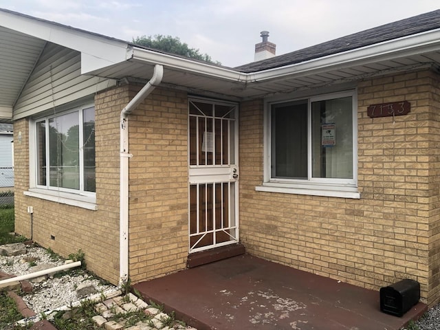 7153 W 72nd St, Nottingham Park, IL 60638 - view of side of home with brick siding, a chimney, and a patio area