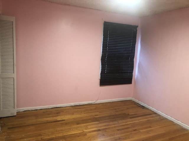 7153 W 72nd St, Nottingham Park, IL 60638 - empty room with wood finished floors and baseboards