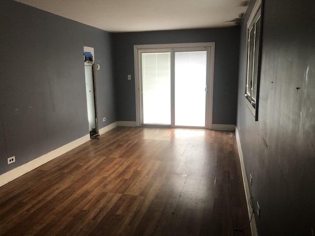 7153 W 72nd St, Nottingham Park, IL 60638 - spare room featuring dark wood finished floors and baseboards