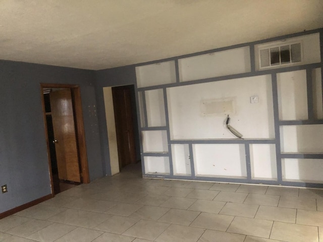 7153 W 72nd St, Nottingham Park, IL 60638 - spare room with light tile patterned flooring