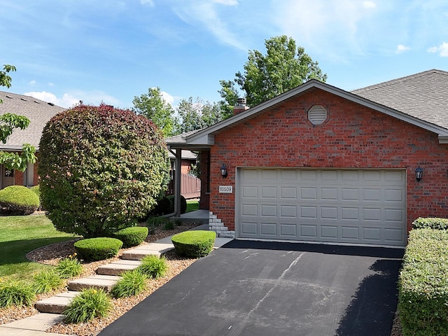 10509 San Luis Ln, Orland Park, IL 60467 - view of front of house featuring brick siding, driveway, and a garage