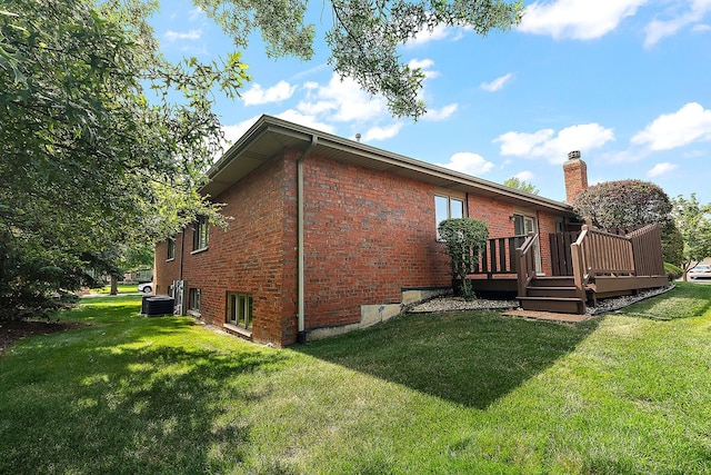10509 San Luis Ln, Orland Park, IL 60467 - back of property featuring a lawn, brick siding, a wooden deck, and a chimney