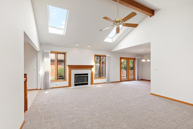 10509 San Luis Ln, Orland Park, IL 60467 - unfurnished living room with a skylight, beam ceiling, high vaulted ceiling, light colored carpet, and a fireplace