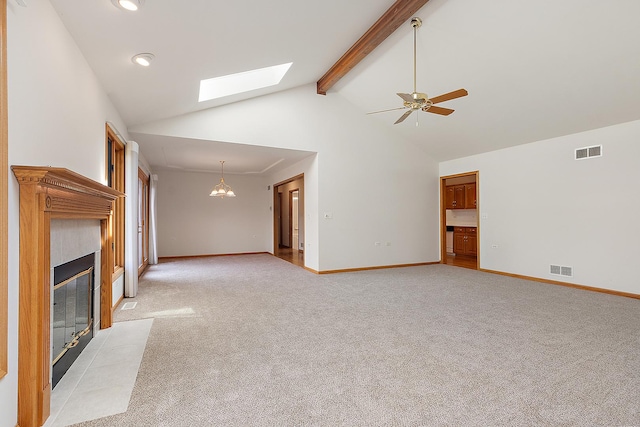 10509 San Luis Ln, Orland Park, IL 60467 - unfurnished living room featuring a skylight, light colored carpet, a tiled fireplace, beam ceiling, and high vaulted ceiling