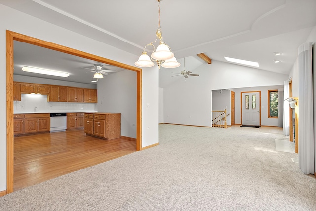 10509 San Luis Ln, Orland Park, IL 60467 - kitchen featuring light carpet, a ceiling fan, open floor plan, brown cabinets, and dishwasher