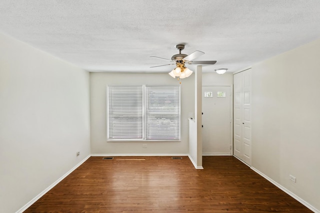 7523 Bristol Ln Unit A, Hanover Park, IL 60133 - unfurnished room with wood finished floors, a ceiling fan, and a textured ceiling