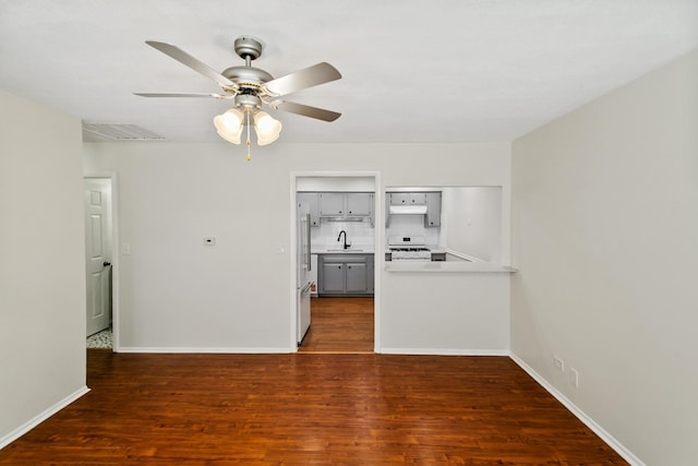 7523 Bristol Ln Unit A, Hanover Park, IL 60133 - unfurnished living room featuring ceiling fan and wood finished floors