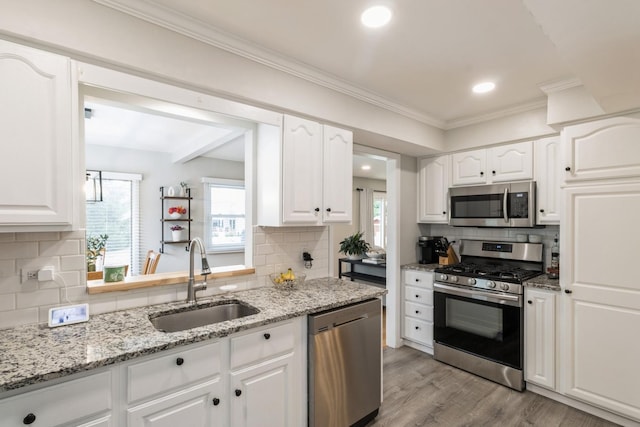 639 N Stephen Dr, Palatine, IL 60067 - kitchen featuring stainless steel appliances, tasteful backsplash, white cabinets, crown molding, and recessed lighting