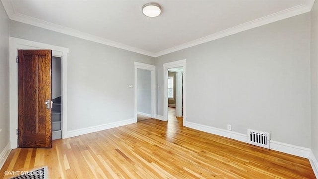 5041 W Fletcher St, Chicago, IL 60641 - spare room featuring light wood-type flooring and ornamental molding