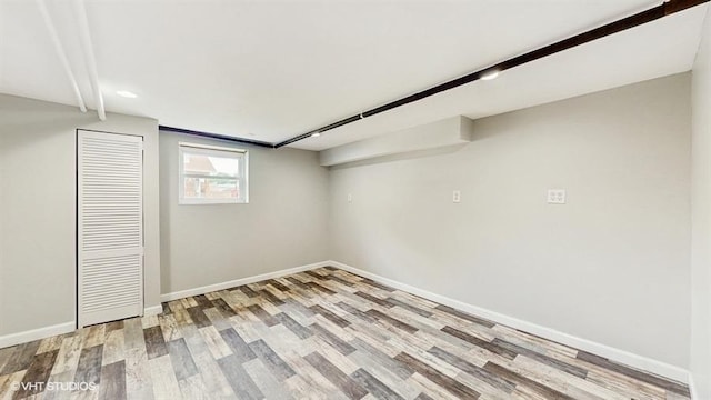 5041 W Fletcher St, Chicago, IL 60641 - below grade area with light wood-style floors and baseboards