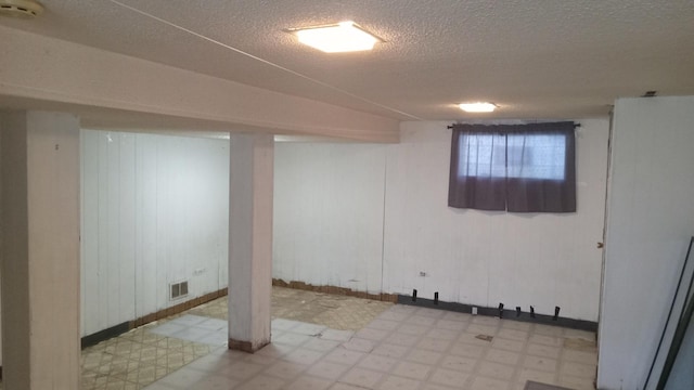 3512 W 84th St, Chicago, IL 60652 - basement featuring light floors and a textured ceiling