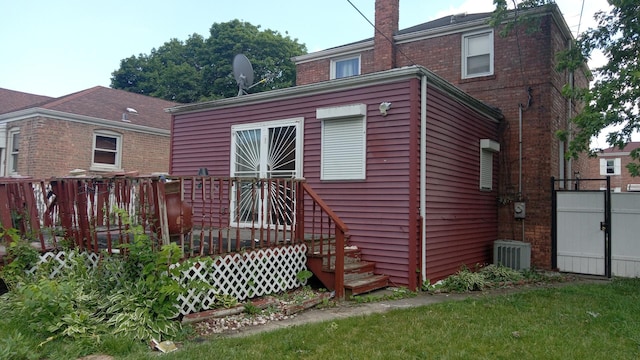 3512 W 84th St, Chicago, IL 60652 - rear view of property featuring a wooden deck, a chimney, and brick siding