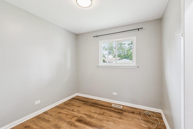404 Virginia Pl, Wheeling, IL 60090 - empty room with wood finished floors and baseboards