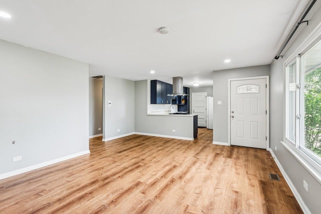 404 Virginia Pl, Wheeling, IL 60090 - unfurnished living room with light wood finished floors and recessed lighting