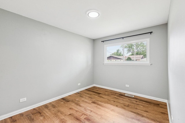404 Virginia Pl, Wheeling, IL 60090 - unfurnished room featuring baseboards and wood finished floors