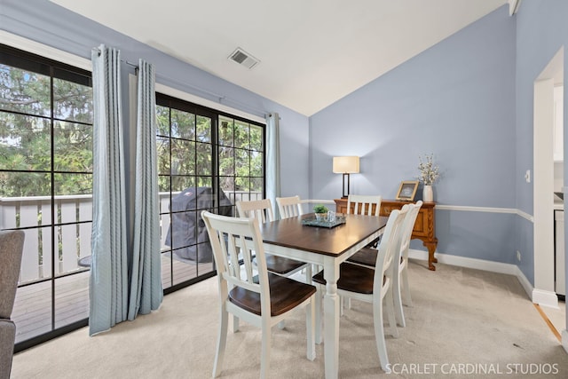 1675 Grosvenor Cir Unit D, Wheaton, IL 60189 - dining space featuring lofted ceiling, light carpet, and healthy amount of natural light