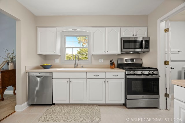 1675 Grosvenor Cir Unit D, Wheaton, IL 60189 - kitchen with appliances with stainless steel finishes, light countertops, light tile patterned flooring, and white cabinets